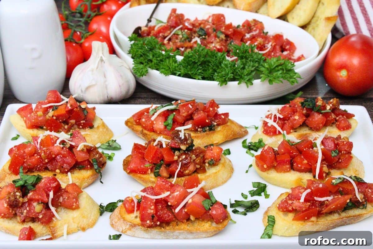 11 Creative Air Fryer Tomato Recipes for Flavorful Meals 3 slices of air fryer bruschetta on a white serving platter in front of a bowl of additional bruschetta topping