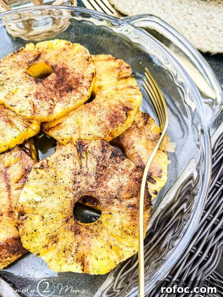 9 Tropical Cocktail Appetizers for Your Next Party 11 Plate of fresh grilled pineapple rings.