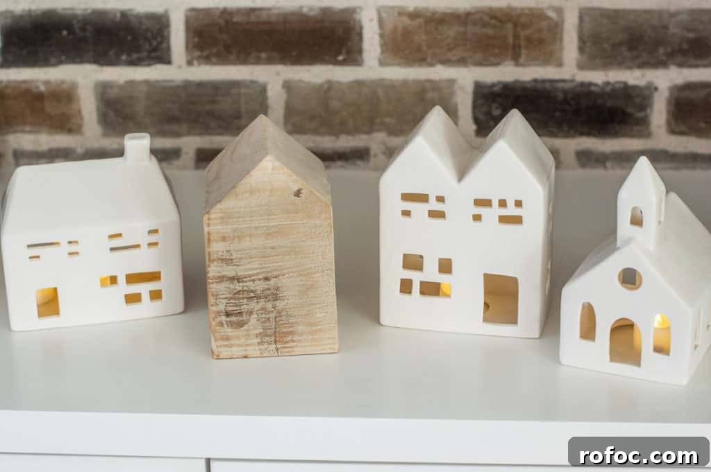 How to Create a Cozy Hygge Christmas Atmosphere 12 Little ceramic christmas houses and a wood house
