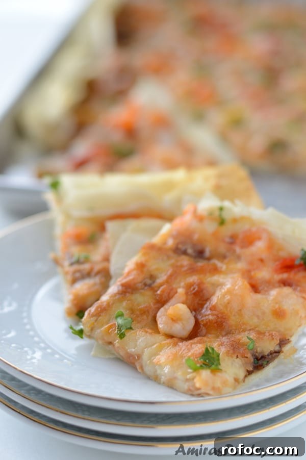 Game-Day Shrimp Phyllo Pizza Bites: Crispy Appetizer Recipe 8 A close up of a plate of food, with Pizza slice