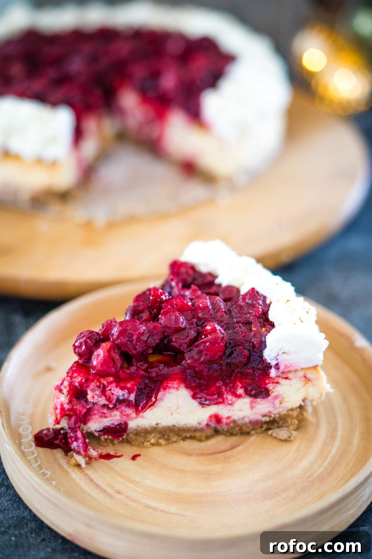 Low-Carb Cranberry Cheesecake: Keto Holiday Dessert Recipe 12 A decadent slice of cranberry cheesecake on a plate.