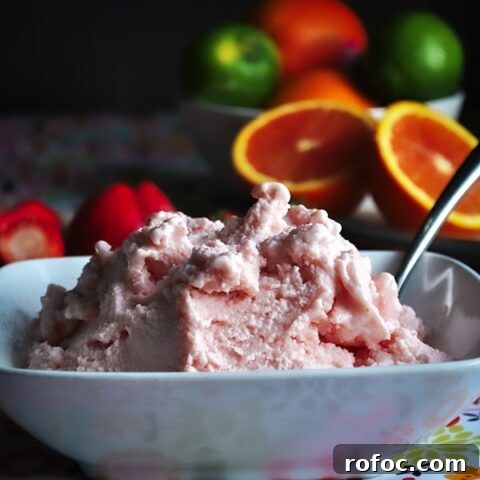 A bowl of healthy strawberry frozen yogurt.