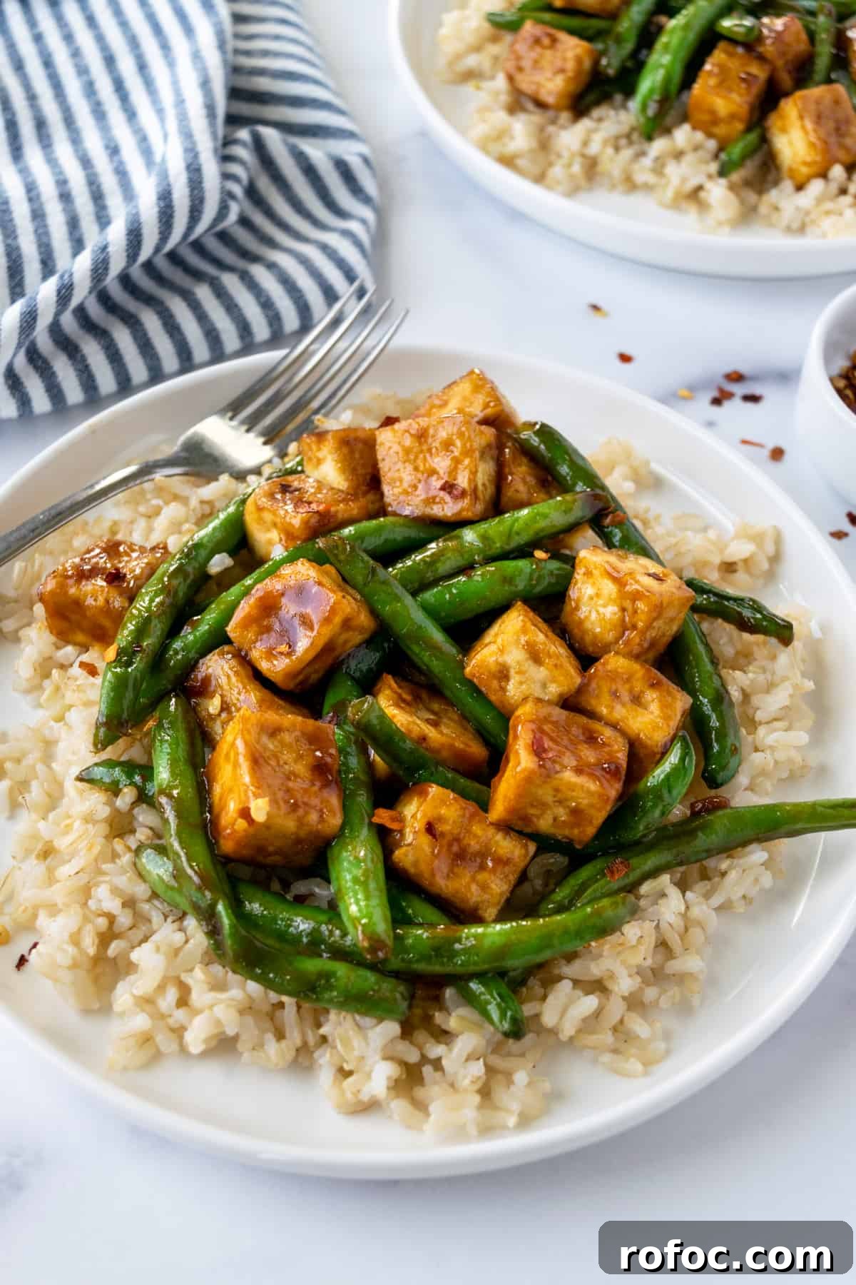 Teriyaki Tofu Stir-Fry with Crispy Green Beans 5 Teriyaki Tofu Stir Fry with Green Beans on a white plate.