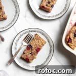 Vegan Gluten-Free Baked Oatmeal Bars Made with Natural Sweeteners 9 Overhead shot of baked oatmeal bars on plates with forks.