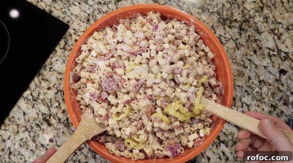 La Scala Pasta Salad Recipe: Classic Italian-Inspired Dish 13 Tossing pasta.