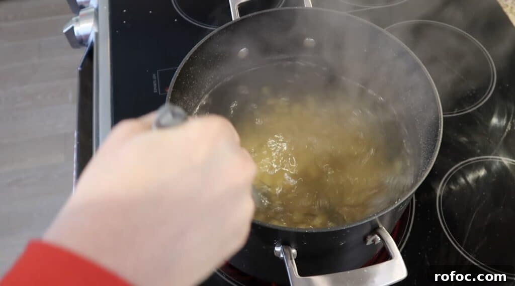 La Scala Pasta Salad Recipe: Classic Italian-Inspired Dish 7 Stirring pasta as it boils
