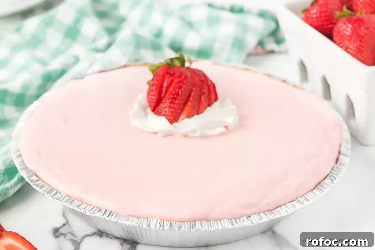 Strawberry Jello Pie: Quick No-Bake Summer Dessert Recipe 4 A whole Strawberry Pie with Slice Strawberries on top.