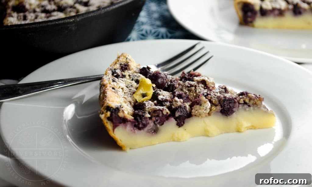 10 Delicious Saskatoon Berry Recipes You’ll Want to Try 11 Saskatoon Berry Clafoutis on a white plate with fork