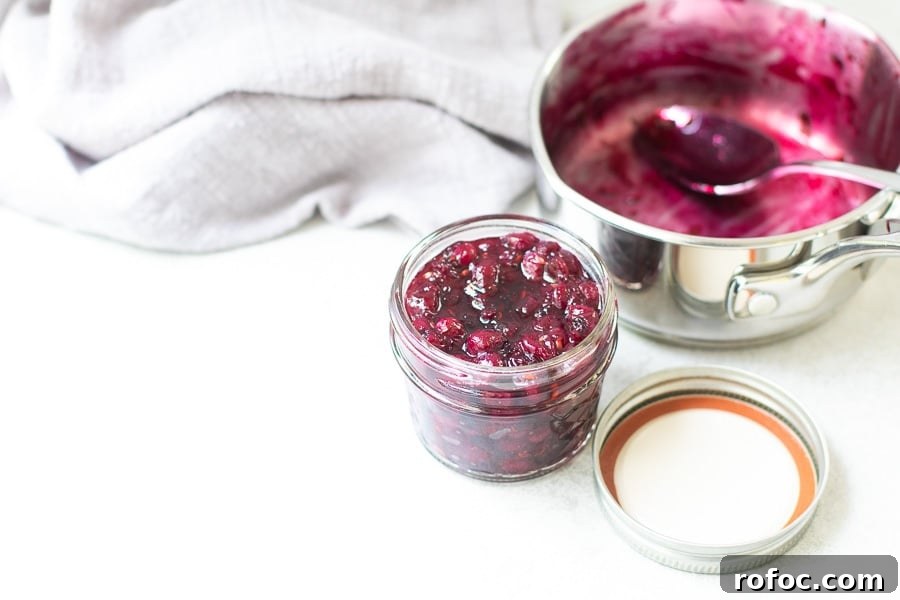 10 Delicious Saskatoon Berry Recipes You’ll Want to Try 13 Saskatoon berry jam in jar with pot in background