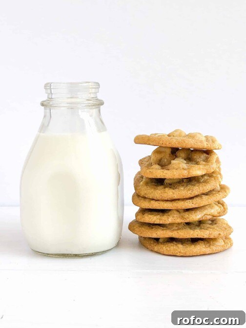 A stack of gluten free white chocolate chip macadamia nut cookies.