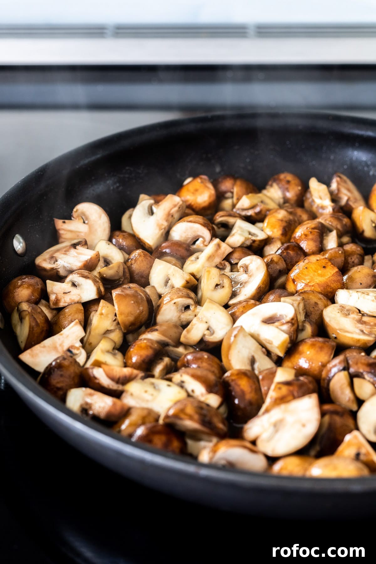 Creamy Mushroom Stroganoff Recipe for Weeknight Dinners 4 Sauteeing mushrooms in a skillet.