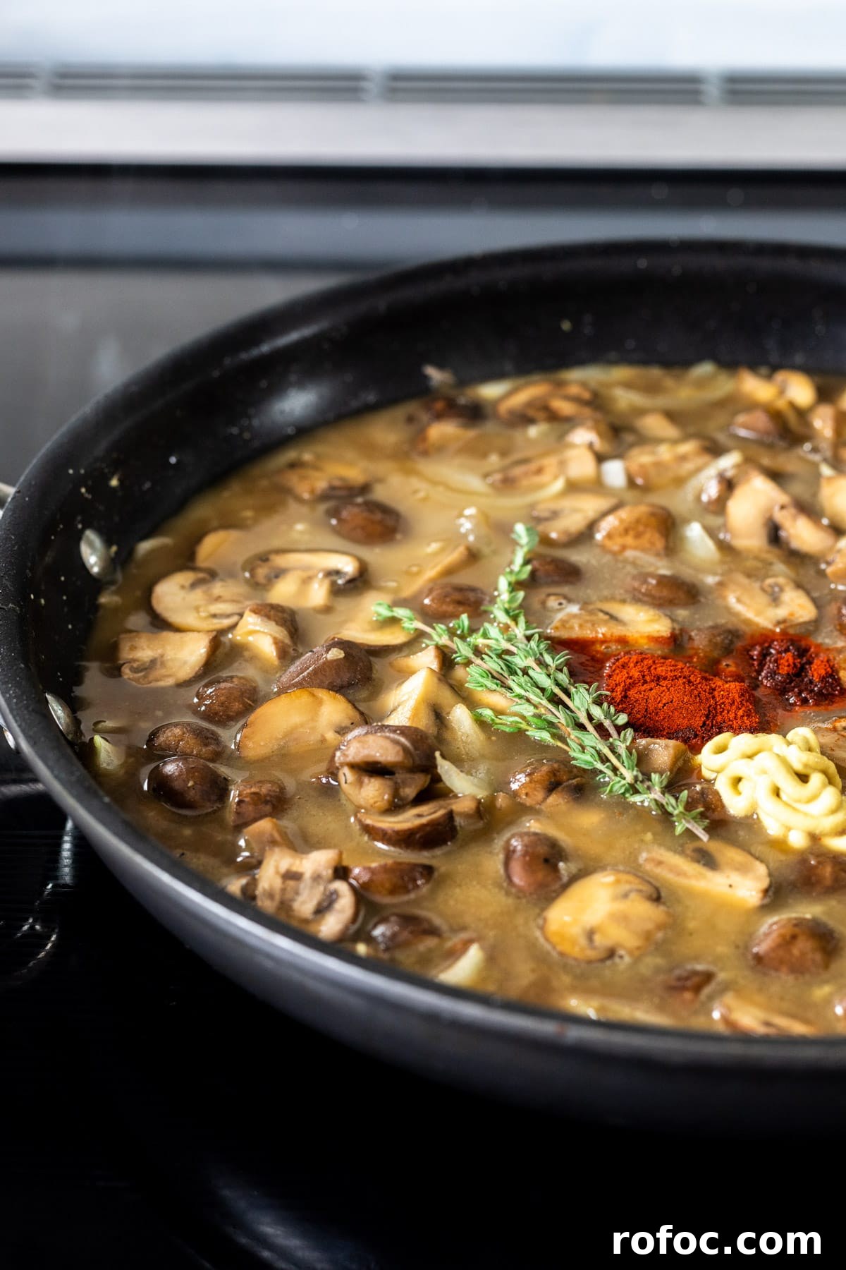 Creamy Mushroom Stroganoff Recipe for Weeknight Dinners 7 Adding spices to stroganoff sauce