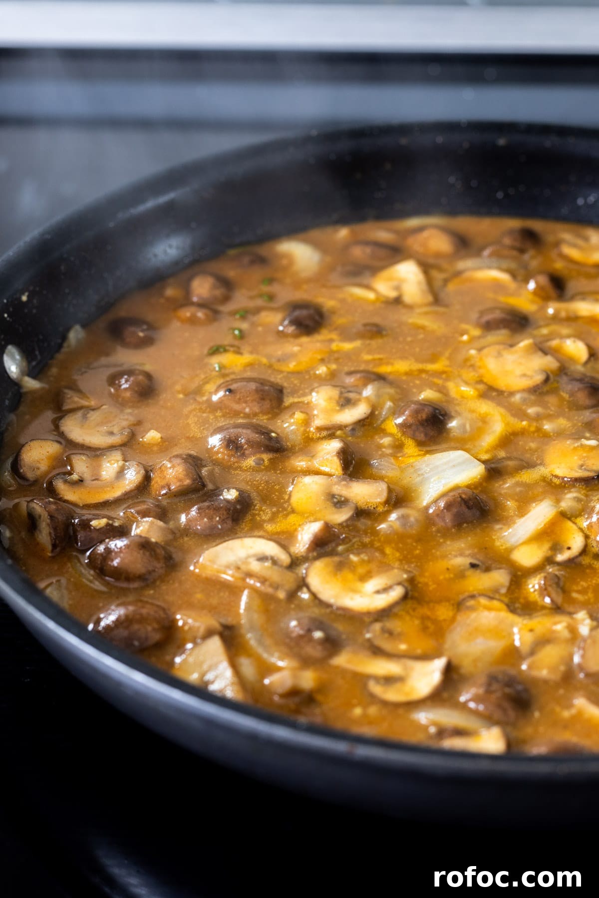 Creamy Mushroom Stroganoff Recipe for Weeknight Dinners 8 Stroganoff sauce simmering in a skilllet.