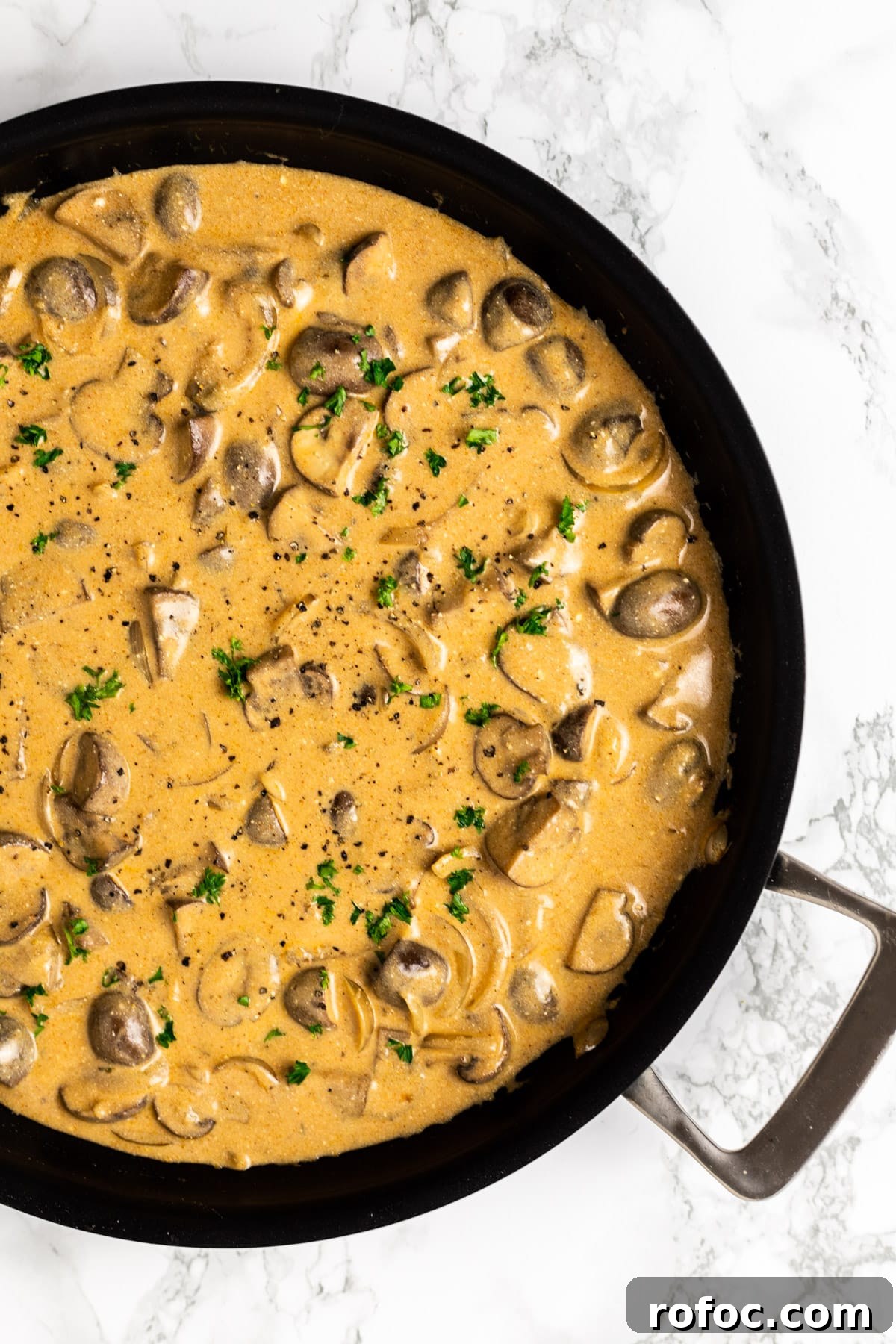 Creamy Mushroom Stroganoff Recipe for Weeknight Dinners 10 A top down view of mushroom stroganoff in a skillet