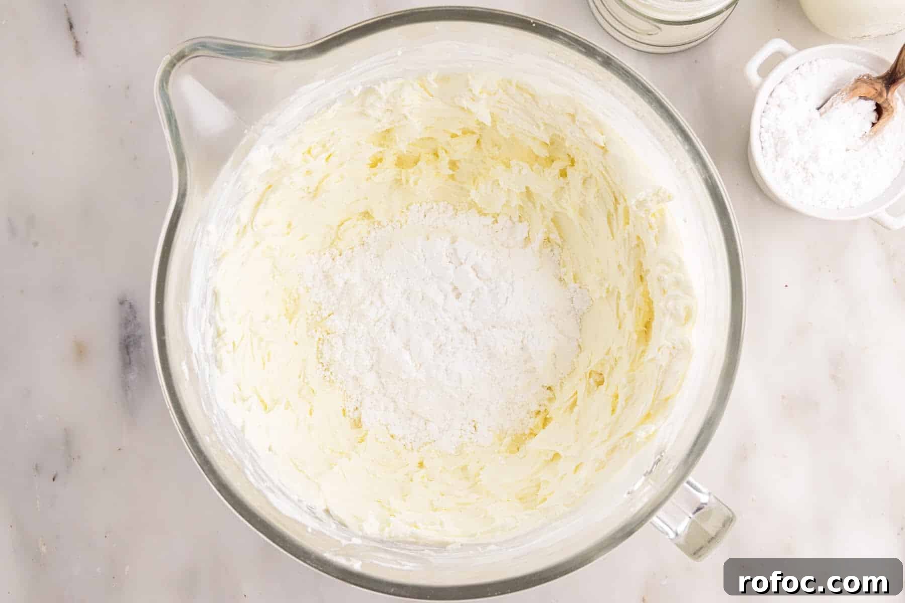 Powdered sugar added to cream cheese mixture.