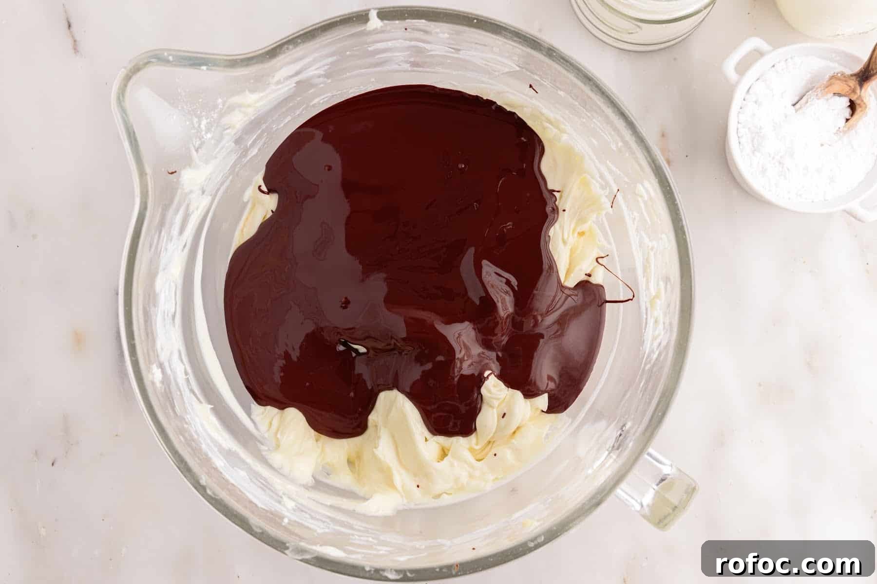 Melted chocolate added to the cream cheese mixture.