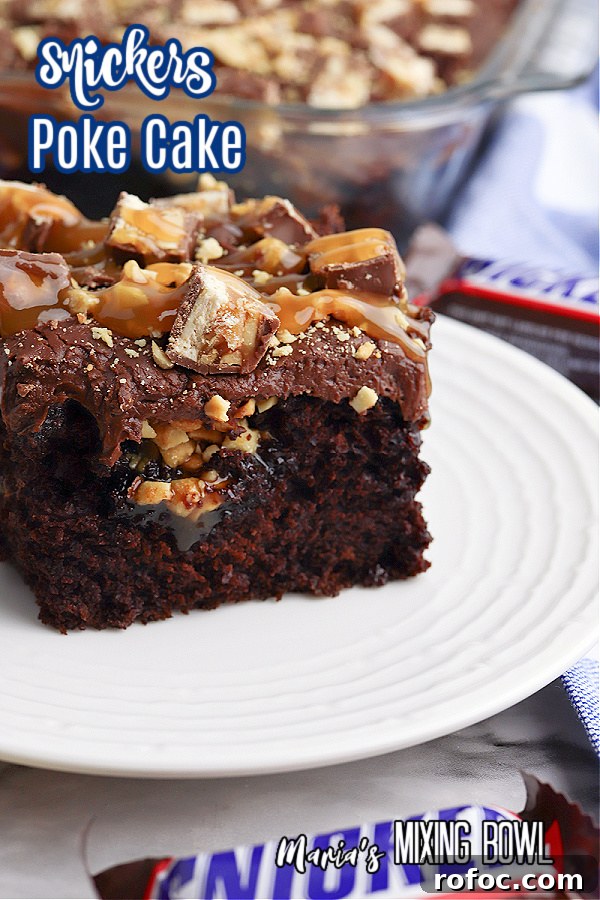 Decadent Snickers Poke Cake: Gooey Chocolate-Caramel Dessert 2 Slice of Snickers poke cake on plate