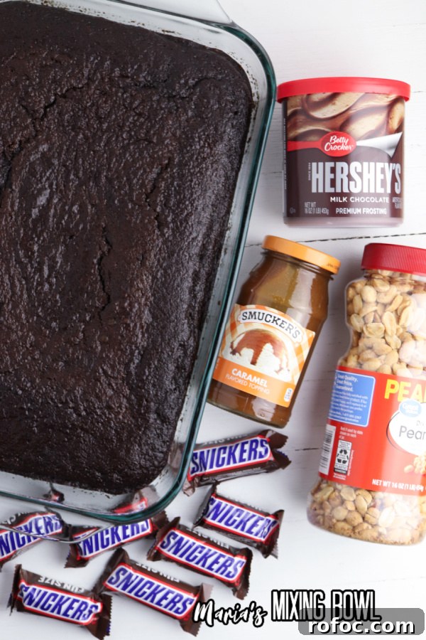 Decadent Snickers Poke Cake: Gooey Chocolate-Caramel Dessert 3 Overhead shot of baked chocolate cake next to other poke cake ingredients