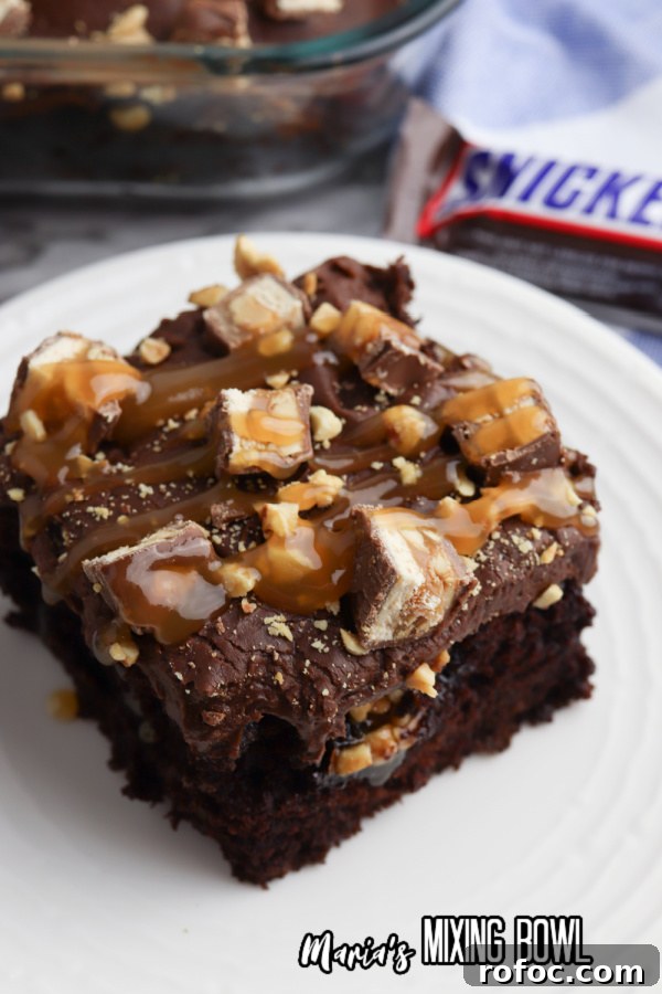 Decadent Snickers Poke Cake: Gooey Chocolate-Caramel Dessert 7 img 48225 6