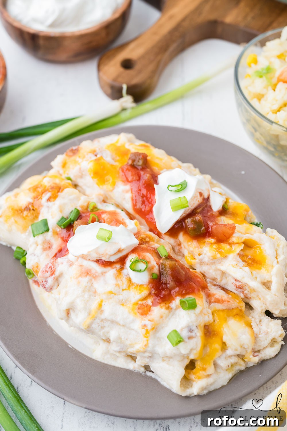 Creamy White Chicken Enchiladas with Tangy Salsa Verde 3 Creamy White Chicken Enchiladas made with flour tortillas, shredded chicken, cheese, sour cream, and more!