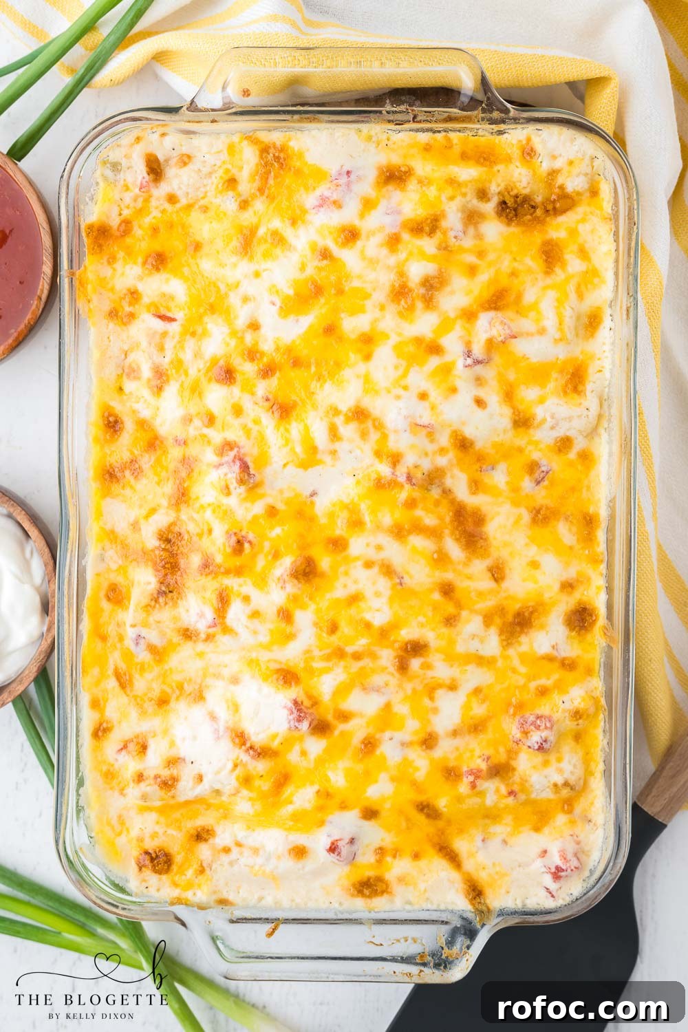 Creamy White Chicken Enchiladas with Tangy Salsa Verde 6 Creamy white enchiladas with cheese on top