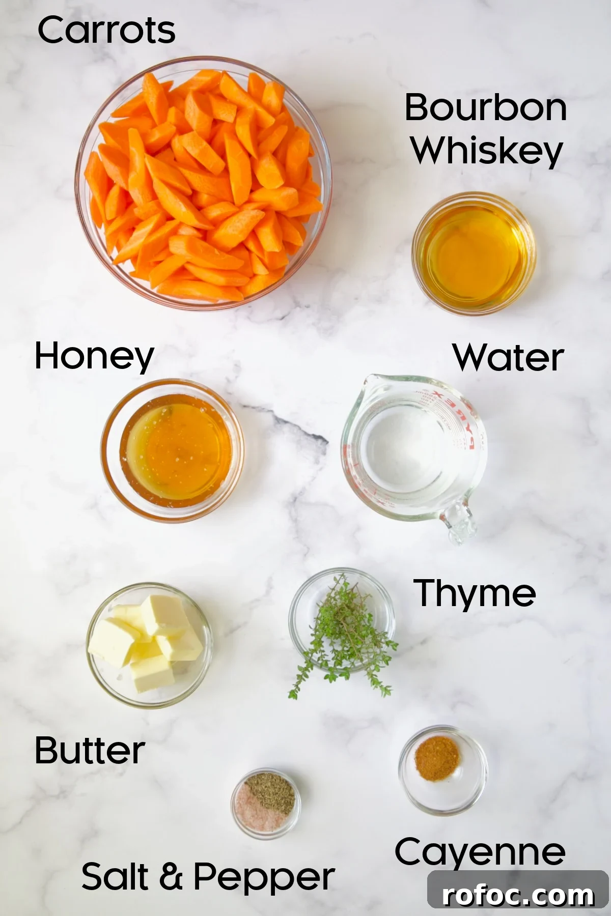Bourbon-Glazed Carrots with Honey and Fresh Thyme 4 Ingredients for Bourbon-Glazed Carrots with Honey in glass bowls.