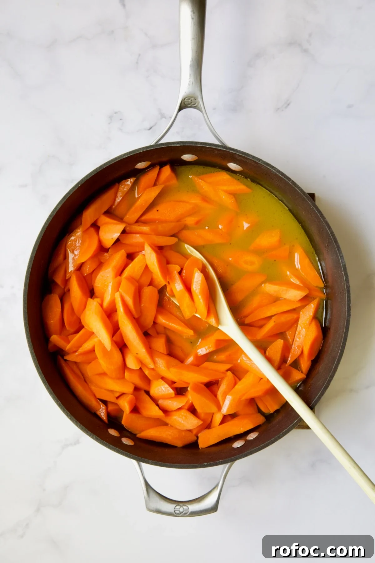 Bourbon-Glazed Carrots with Honey and Fresh Thyme 8 Carrots in glaze ingredients in nonstick skillet.
