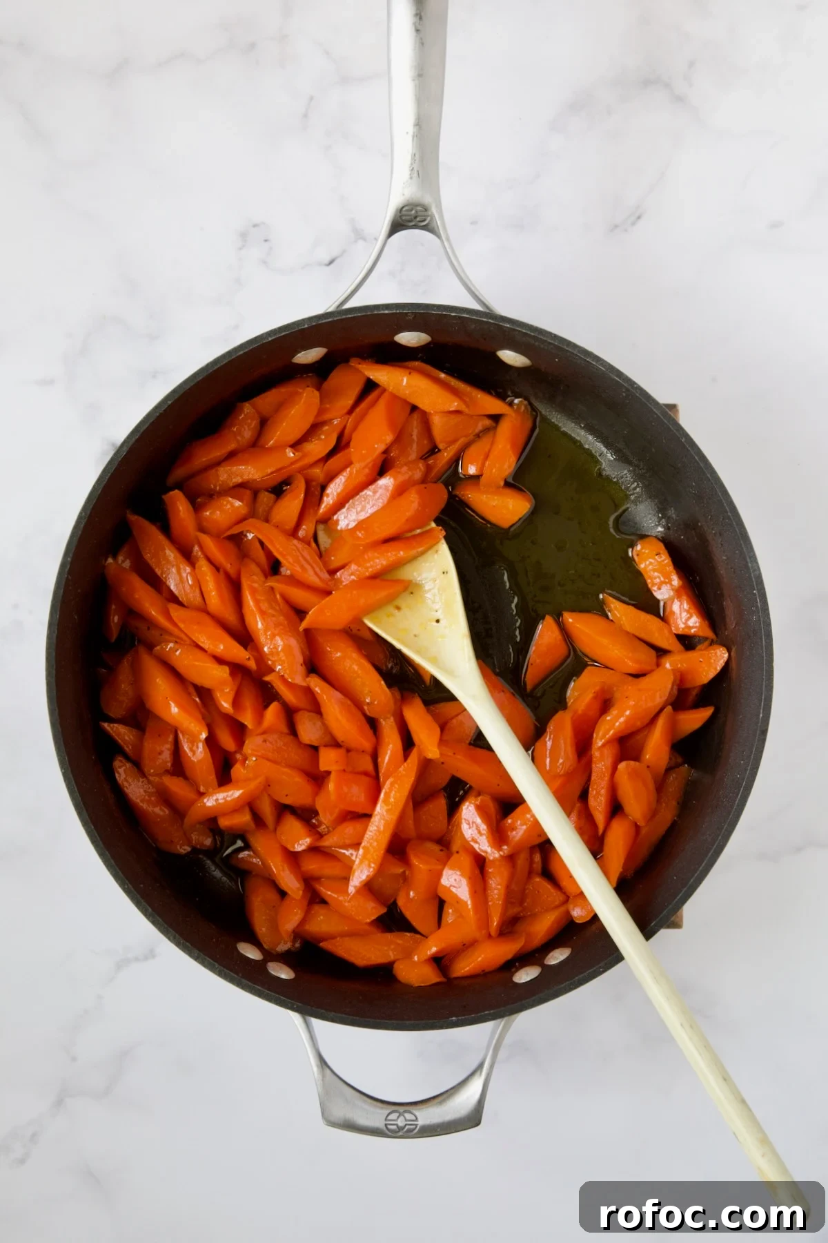 Bourbon-Glazed Carrots with Honey and Fresh Thyme 9 Finished glazed carrots in nonstick skillet.