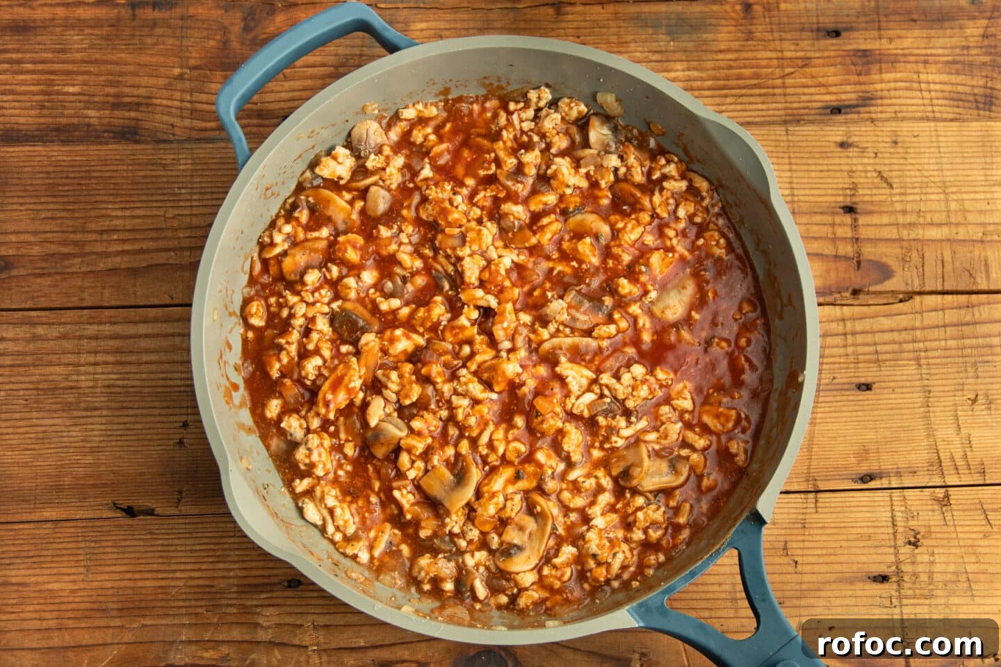 This is a picture of the skillet with the added pizza sauce.