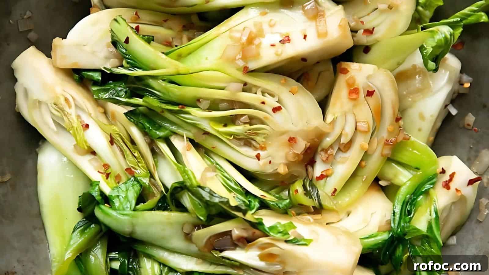 23 Vegetarian Dinners That Even Meat Eaters Will Love 13 Sliced bok choy cooked with garlic, red pepper flakes, and sauce, shown in a close-up view.