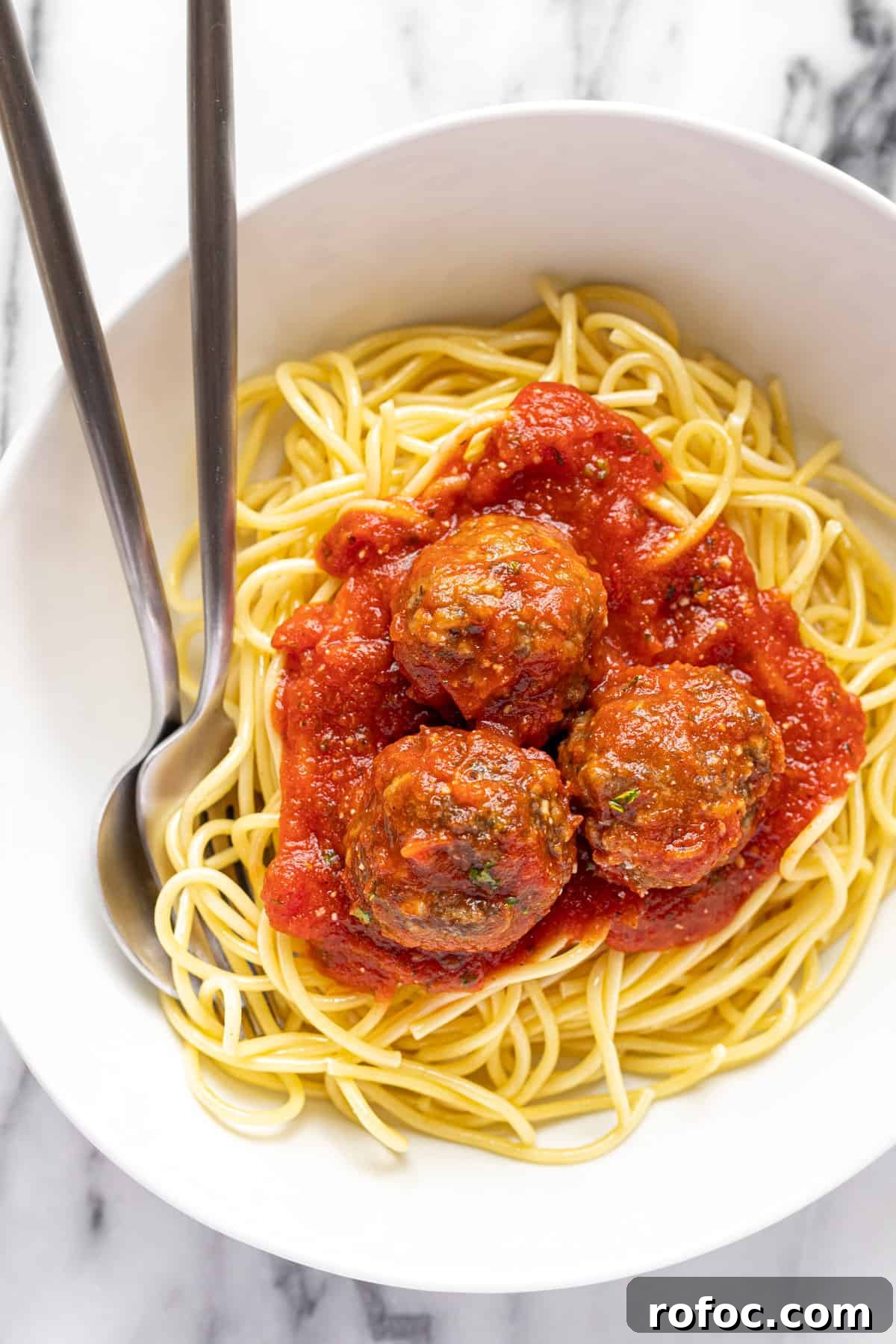 Authentic Italian Meatballs Recipe Ready in 30 Minutes 2 White bowl filled with spaghetti with homemade meatballs.