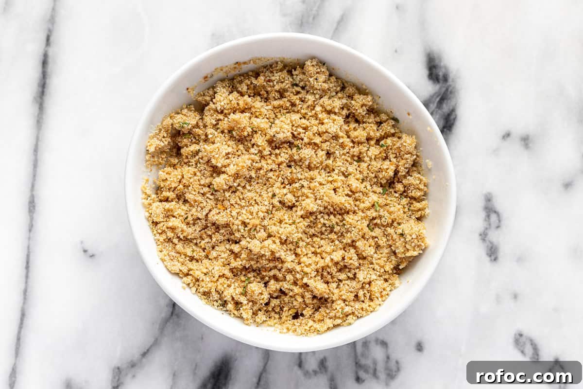 Authentic Italian Meatballs Recipe Ready in 30 Minutes 4 White bowl filled with breadcrumb and milk mixture.