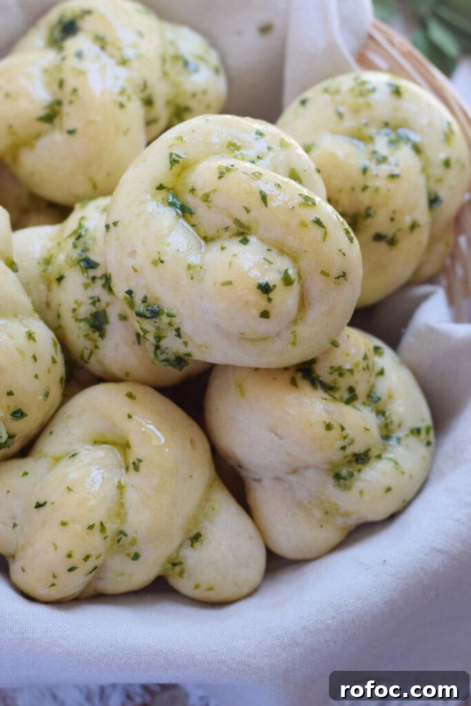 How to Make Homemade Garlic Knots: Soft, Chewy & Flavorful 16 Close up of garlic knots in a basket.