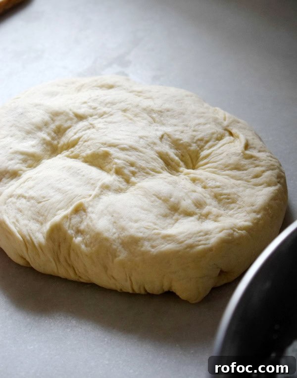 How to Make Homemade Garlic Knots: Soft, Chewy & Flavorful 6 Dough on a white surface.