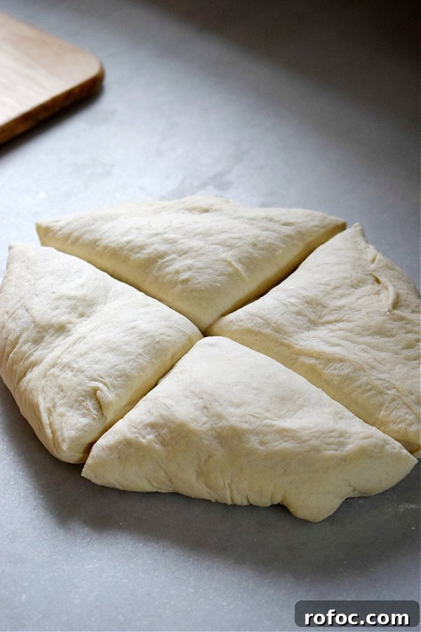 How to Make Homemade Garlic Knots: Soft, Chewy & Flavorful 7 Dough divided into four portions.