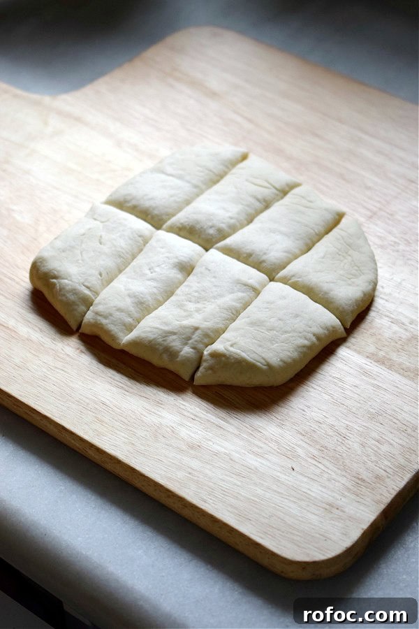 How to Make Homemade Garlic Knots: Soft, Chewy & Flavorful 8 Pizza dough divided into strips