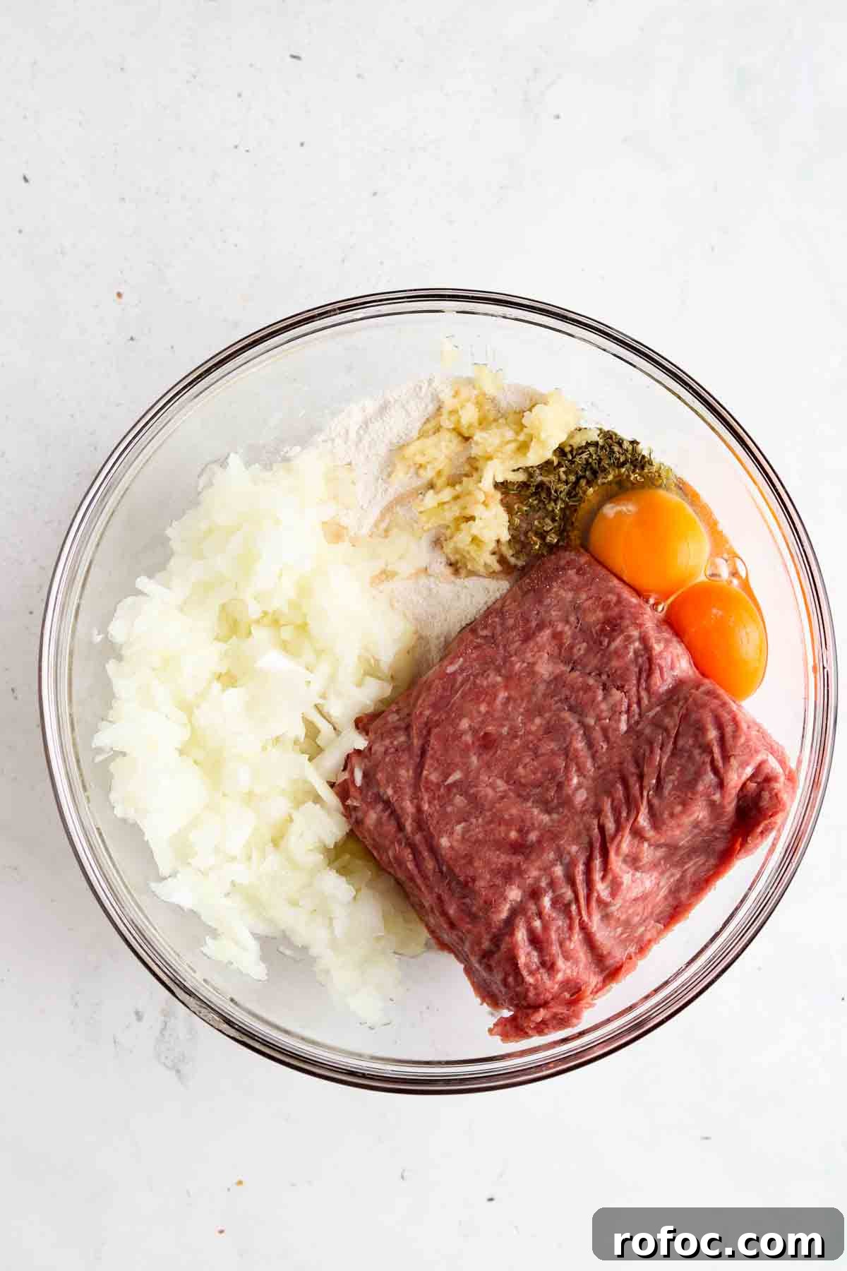 Gluten-Free Meatballs: Savory, Tender Recipe for Dinner 6 All ingredients laid in a clear bowl.
