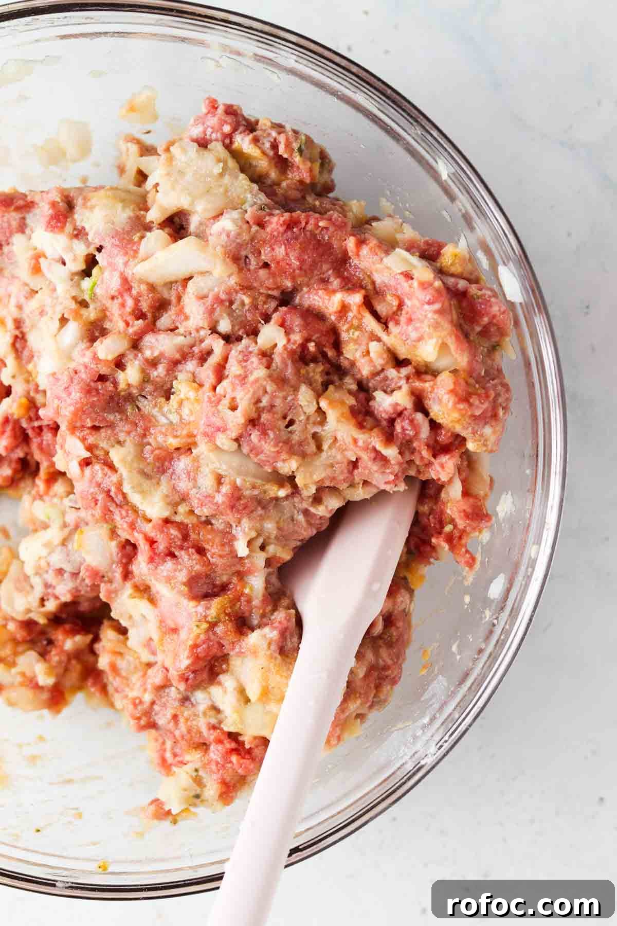 Gluten-Free Meatballs: Savory, Tender Recipe for Dinner 7 Meatball ingredients mixed in a clear bowl.