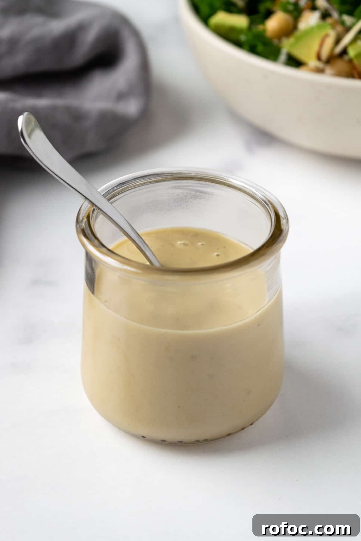 Creamy Lemon Tahini Dressing in a glass jar.