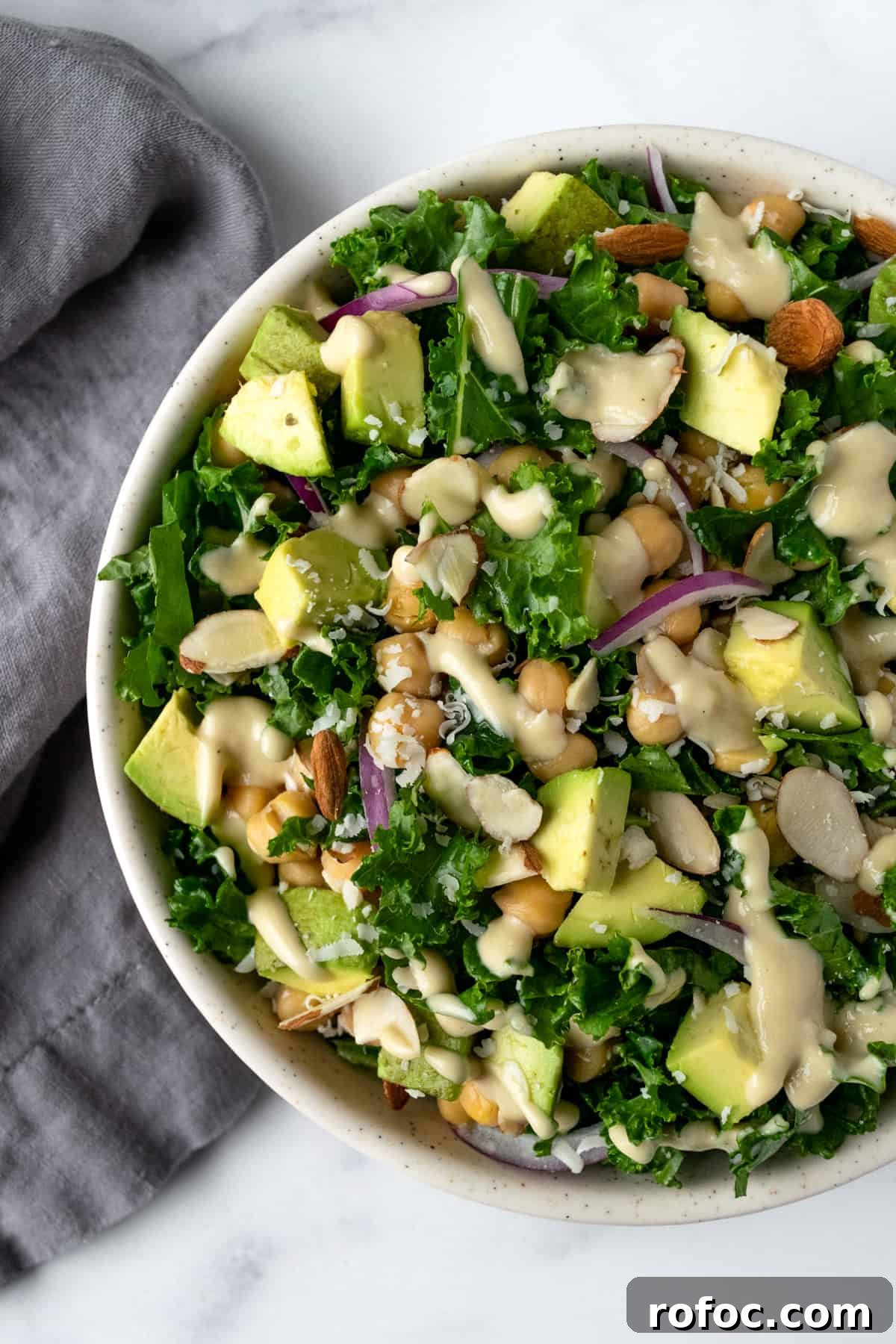 Kale Salad with Tahini Dressing in a serving bowl.