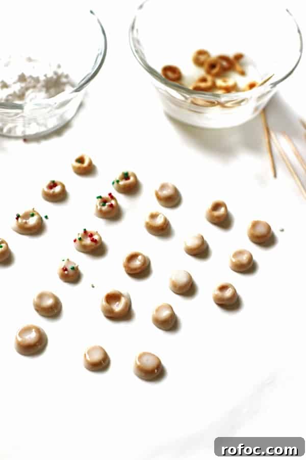 Magical Elf Donuts: Festive Donut Recipes & Decorating Ideas 4 Cheerios covered in powdered sugar mix and red and green sprinkles