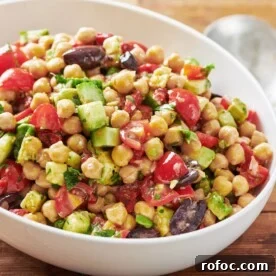 White bowl of chickpea salad.