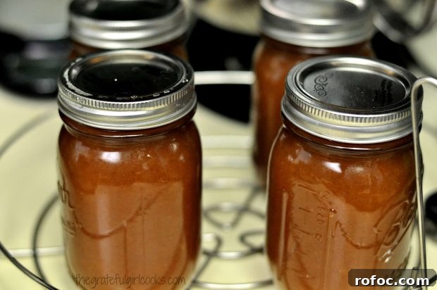 Jars ready for canner Sealed jars of apple butter