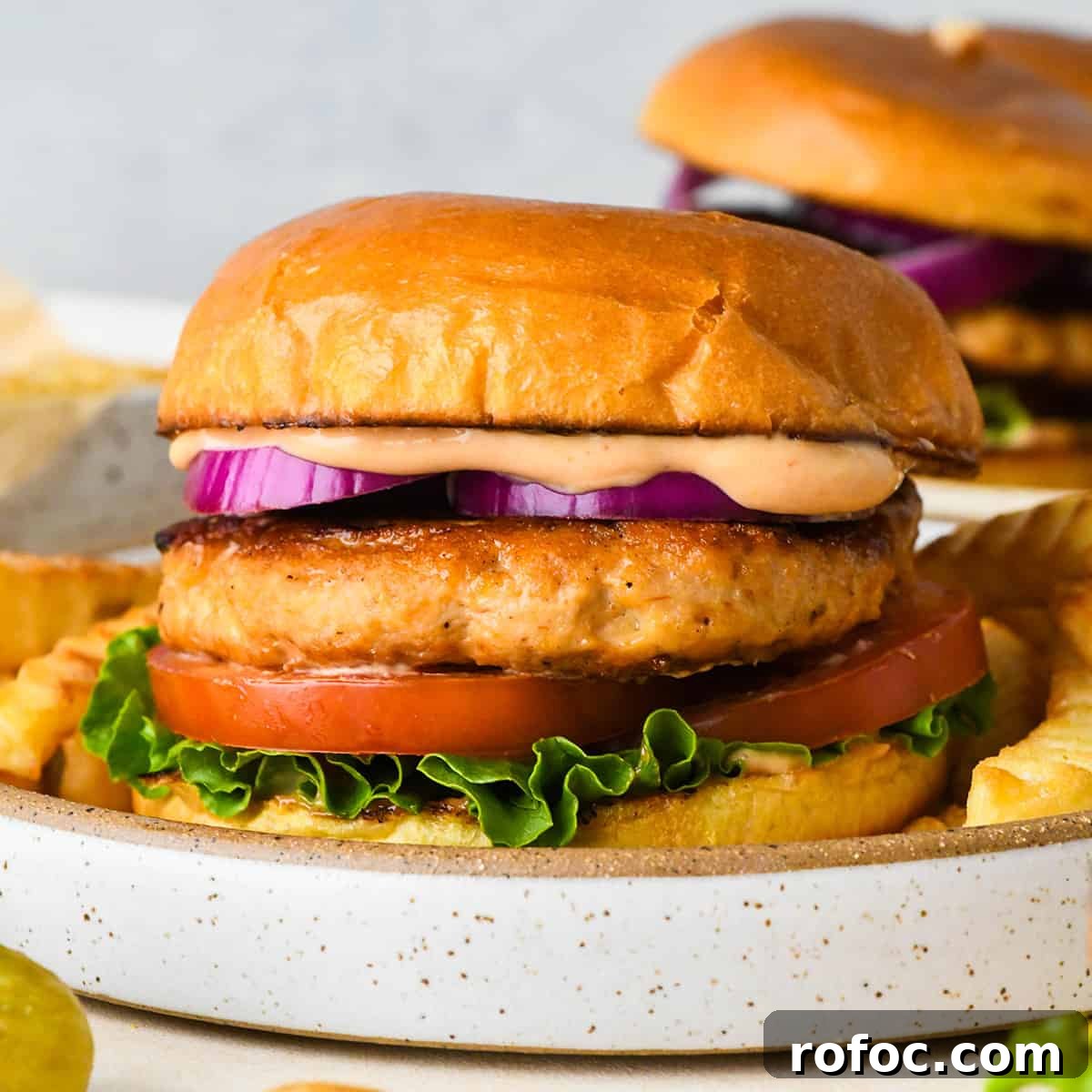 Juicy Turkey Burger Recipes for Flavorful Weeknight Meals 2 Turkey Burger on a plate with a bun and toppings