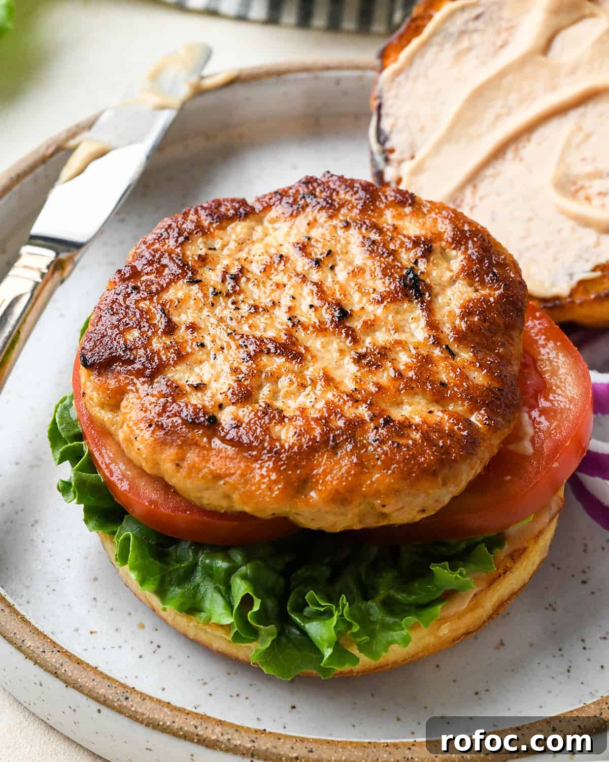 Juicy Turkey Burger Recipes for Flavorful Weeknight Meals 12 a Turkey Burgers on a bun with lettuce and tomatoes
