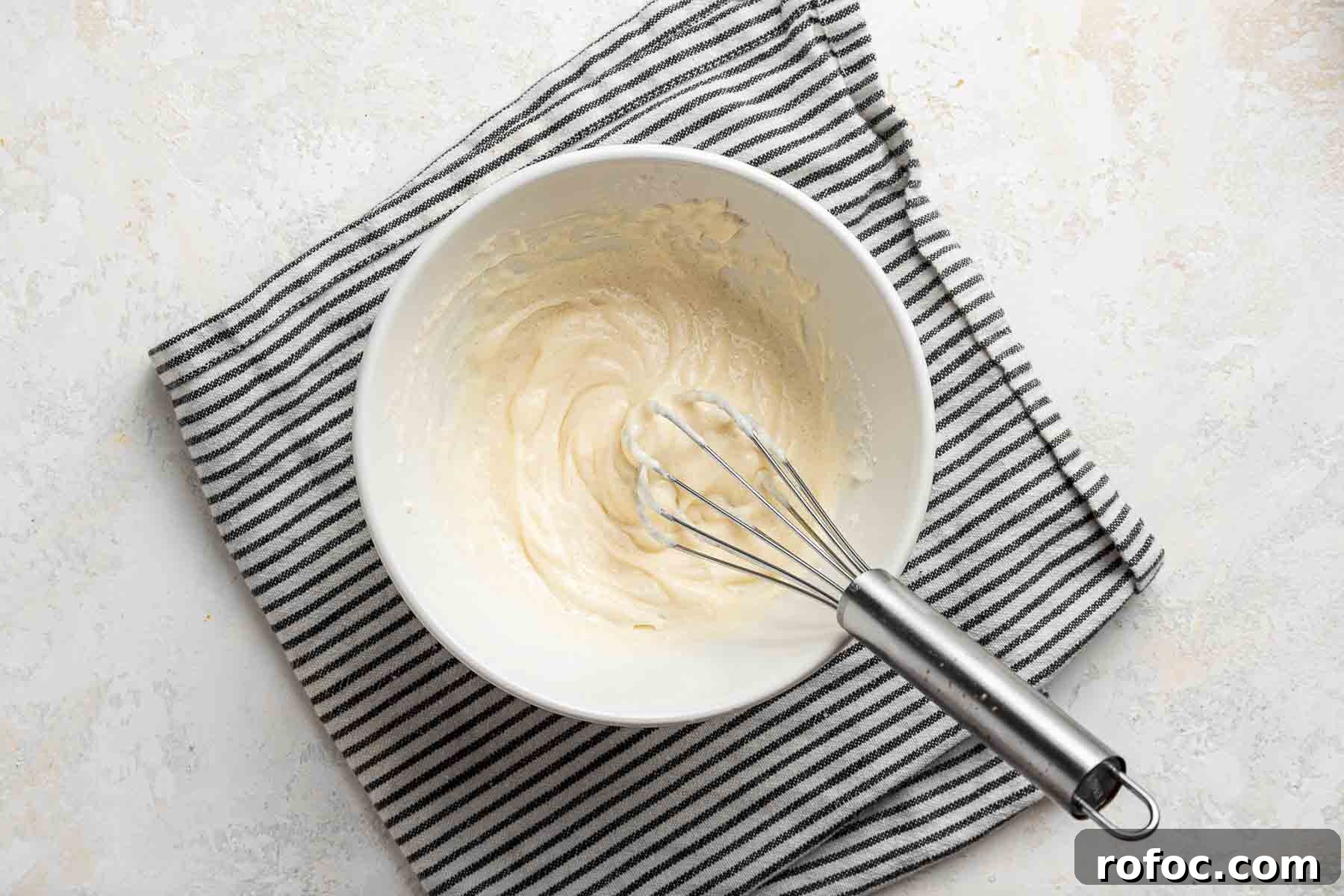 Cheesecake Brownie Bites: Mini Dessert Recipe for Parties 10 Cheesecake batter for swirling into cheesecake brownie bites.