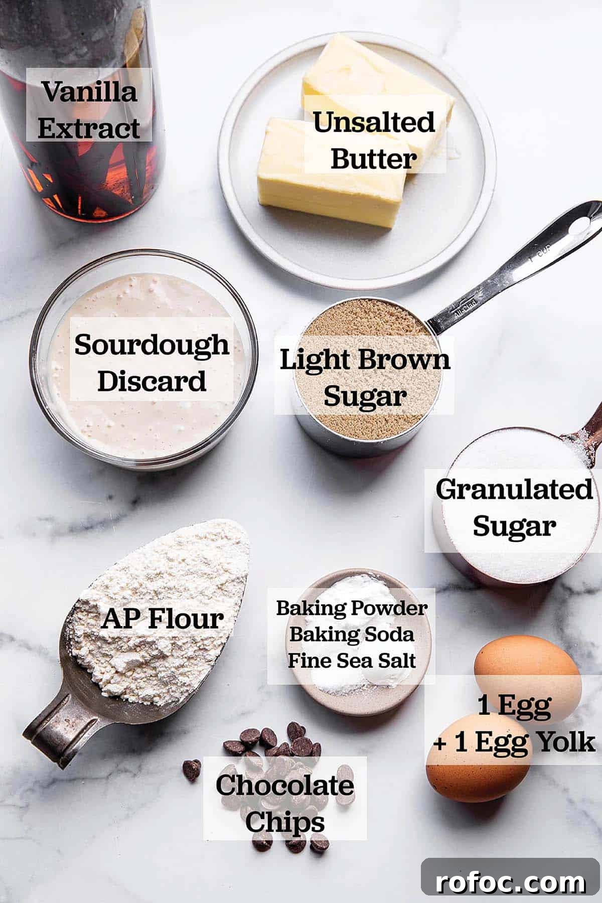 Ingredients in measuring cups and bowls to make a batch of cookies.