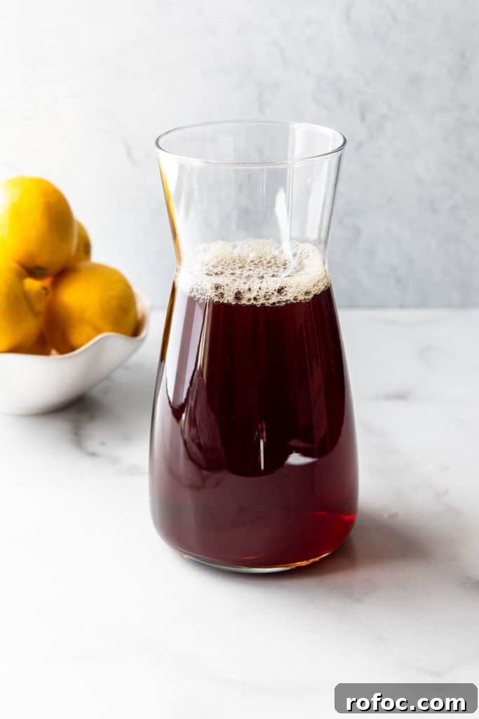 Classic Arnold Palmer Recipe + 3 Refreshing Spiked Variations 6 tea brew in a glass container