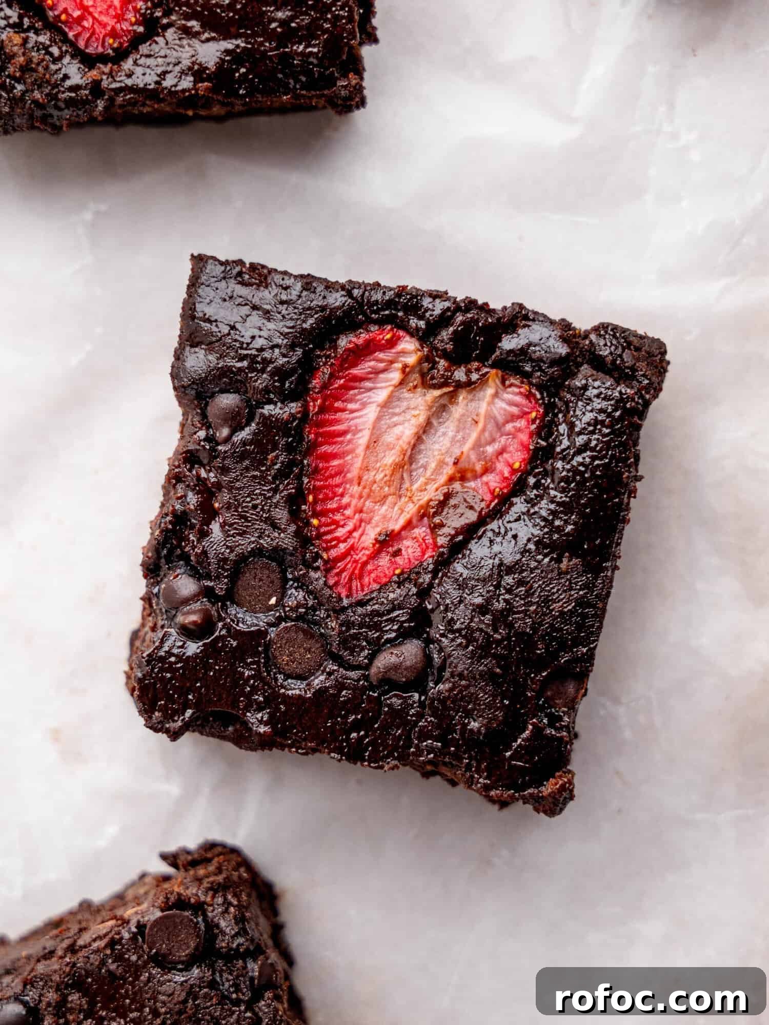 One‑Bowl Strawberry Brownies — Moist, Guilt‑Free Recipe 3 Bird's eye view of a brownie with strawberries.