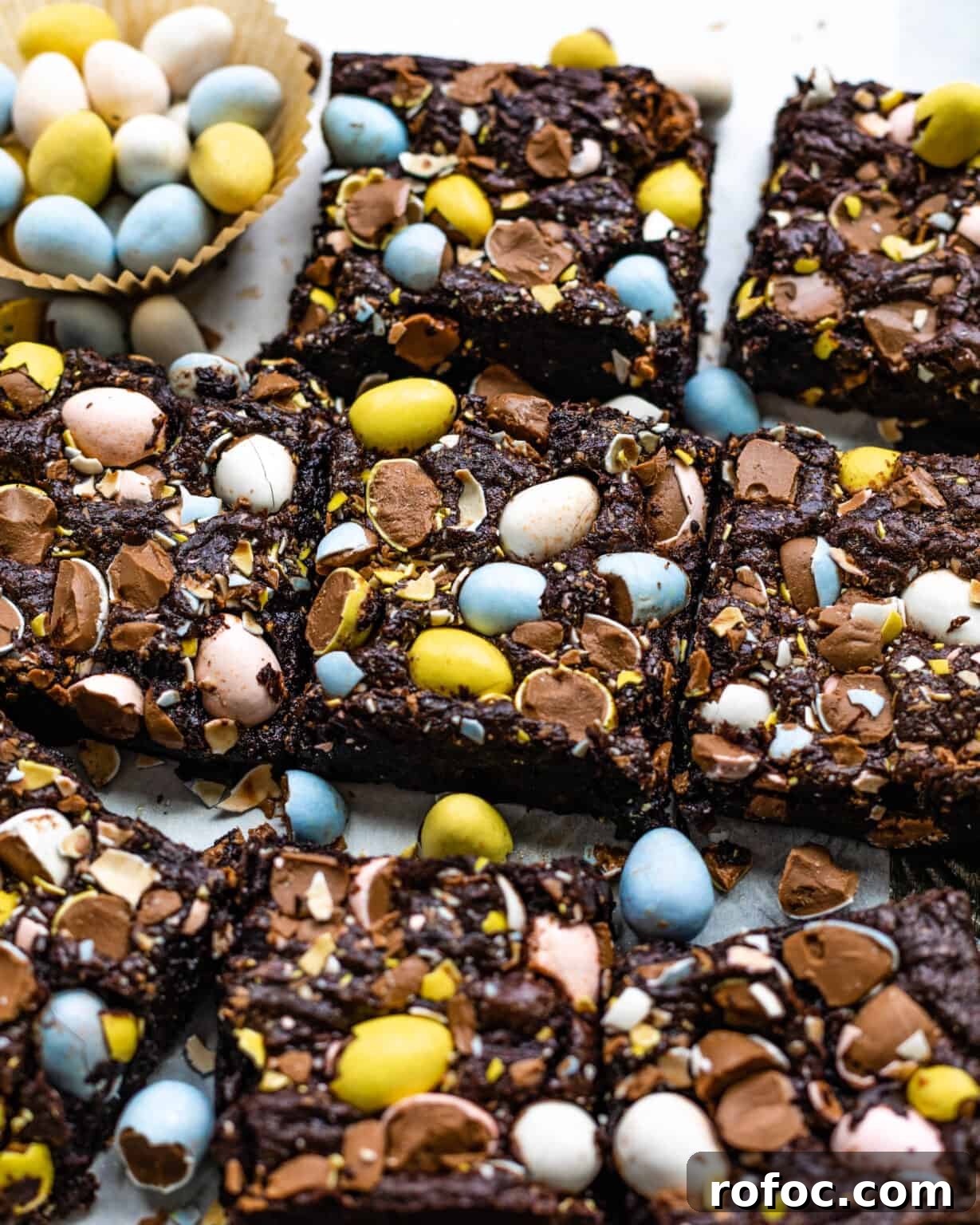 Fudgy Mini Egg Brownies Recipe — Bite-Sized Chocolate Treats 4 mini egg brownies with cadbury eggs pressed into them
